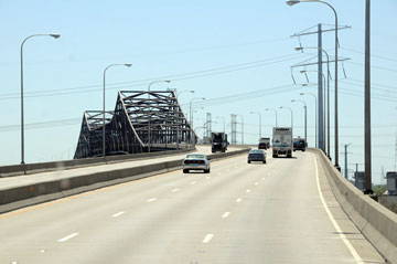 Dashboard view of an expressway, approaching a bridge