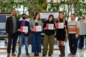 Group photo of the winners holding their certificates