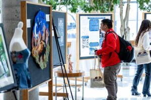 A student looking at some of the contest entries