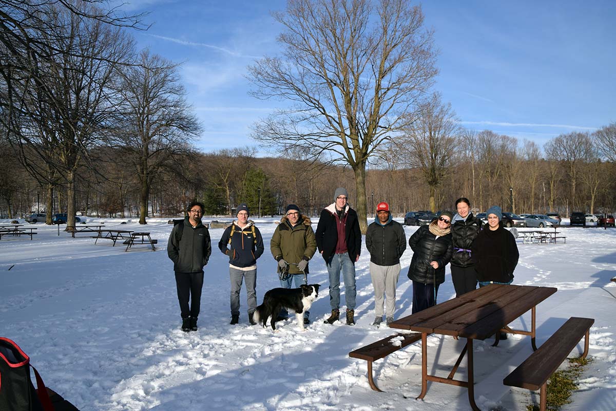 Group photo in a snow-covered picnic area