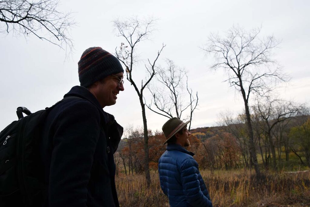 Two hike participants observe the landscape