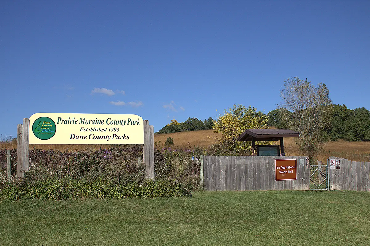 Sign at the park entrance that reads, "Prairie Moraine County Park, Established 1993, Dane County Parks"