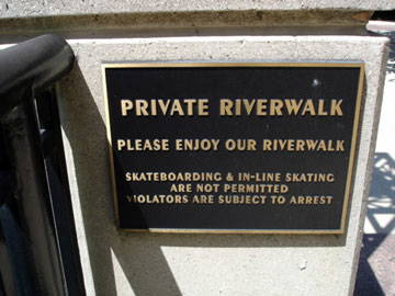 Sign that reads "private riverwalk, please enjoy our riverwalk"