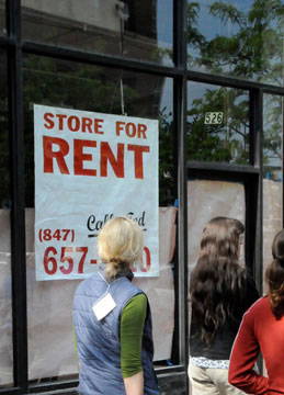 "For rent" sign on a storefront