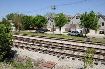Houses across from railroad tracks